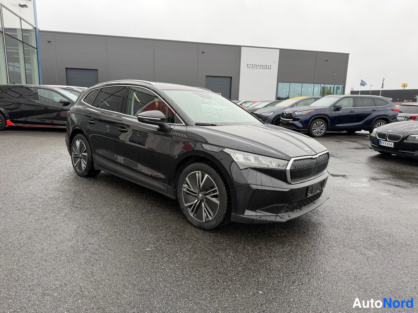 Black Skoda Enyaq 80 2023, front three-quarter, nose to the right, photo 2