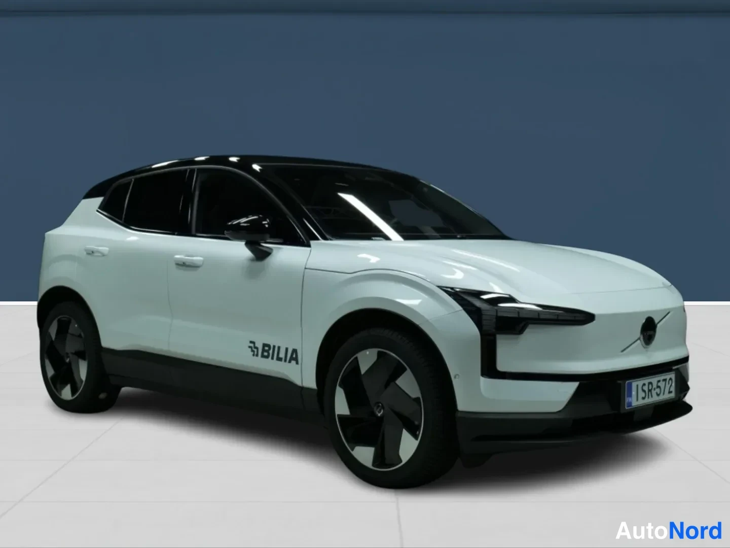 White Volvo EX30 2026, front three-quarter, nose to the right, photo 2