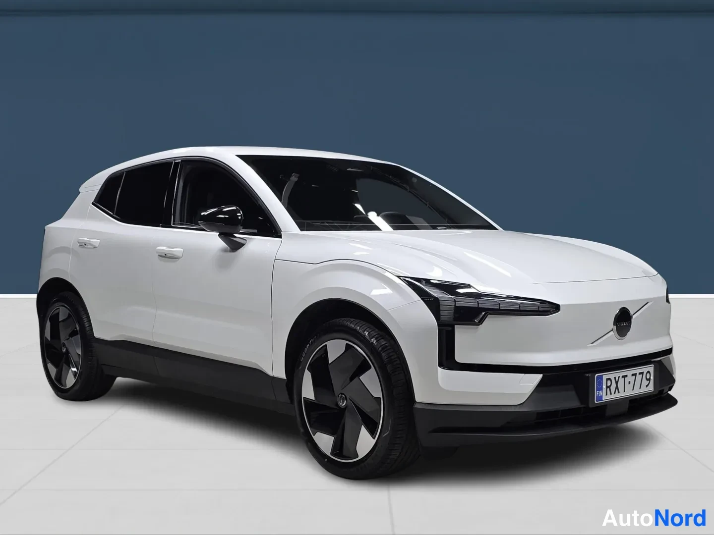 White Volvo EX30 2026, front three-quarter, nose to the right, photo 2