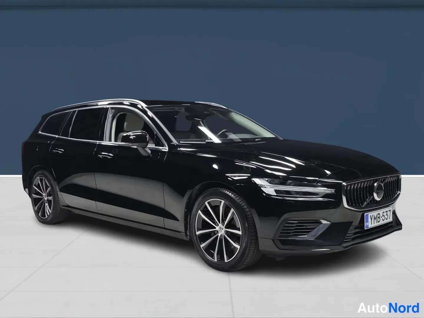 Black Volvo V60 2023, side, photo 2
