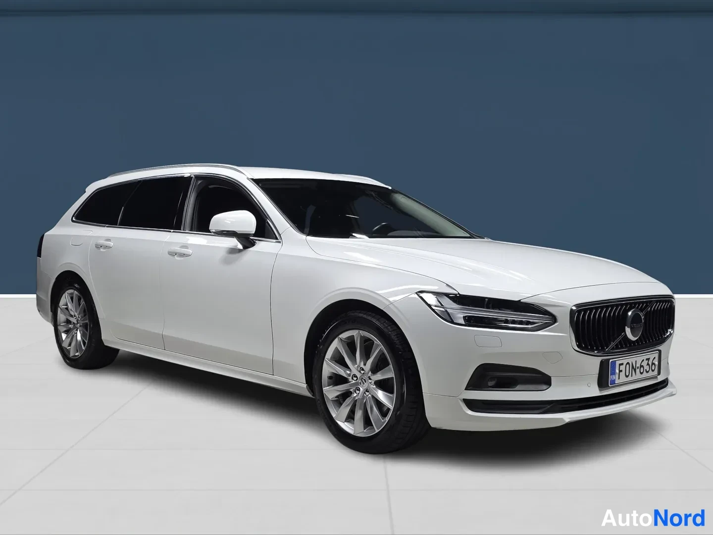 White Volvo V90 2021, front three-quarter, nose to the right, photo 2