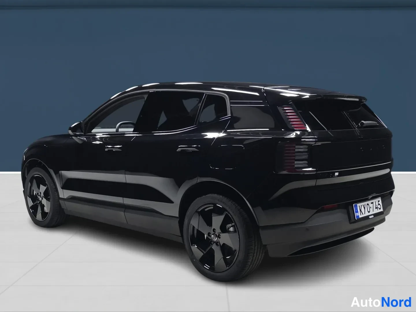 Black Volvo EX30 2027, rear three-quarter, photo 5