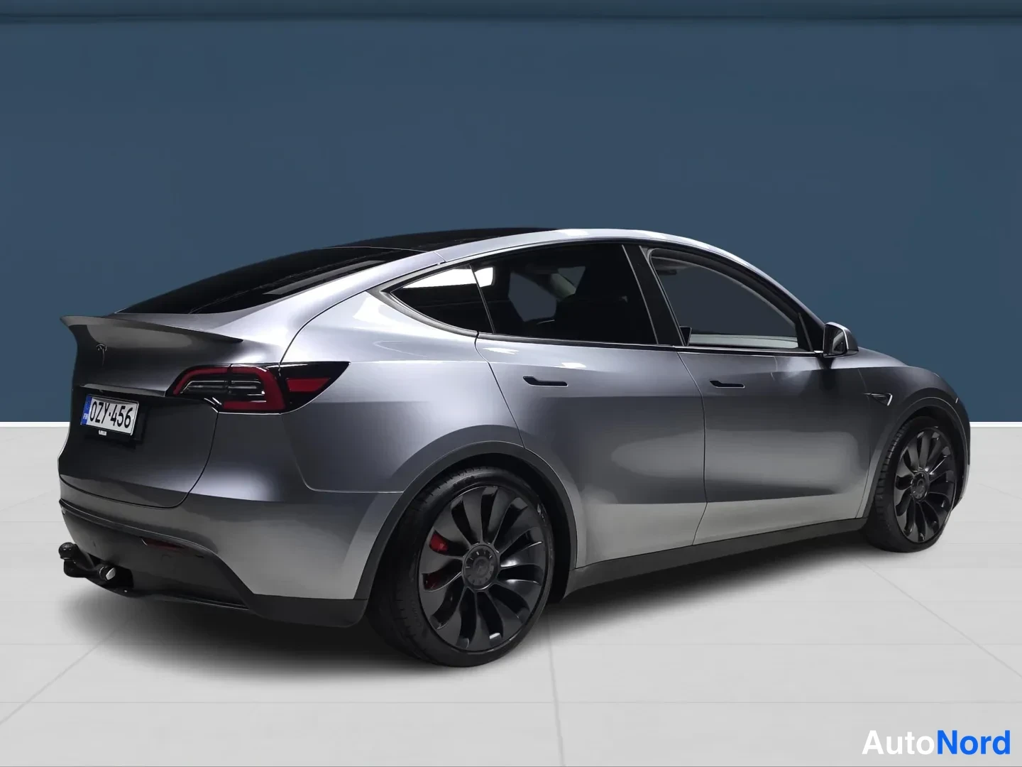 Grey Tesla Model Y 2023, rear three-quarter, photo 4