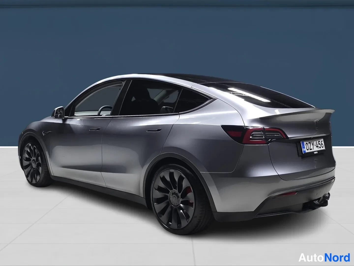 Grey Tesla Model Y 2023, rear three-quarter, photo 5