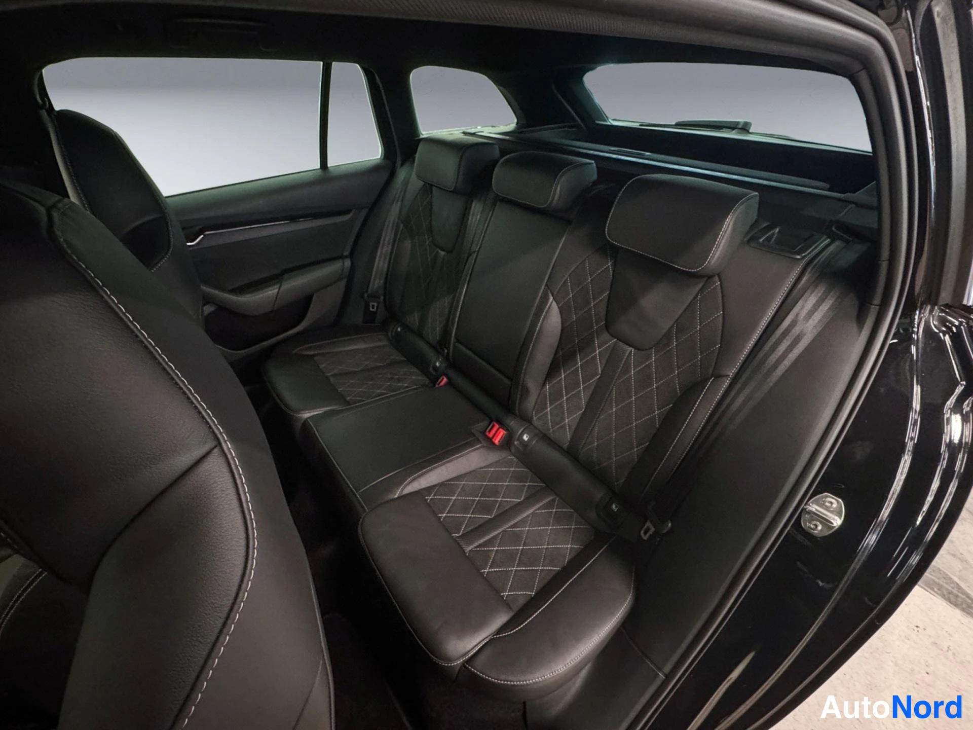 Black Skoda Octavia 2024, rear seats, photo 11