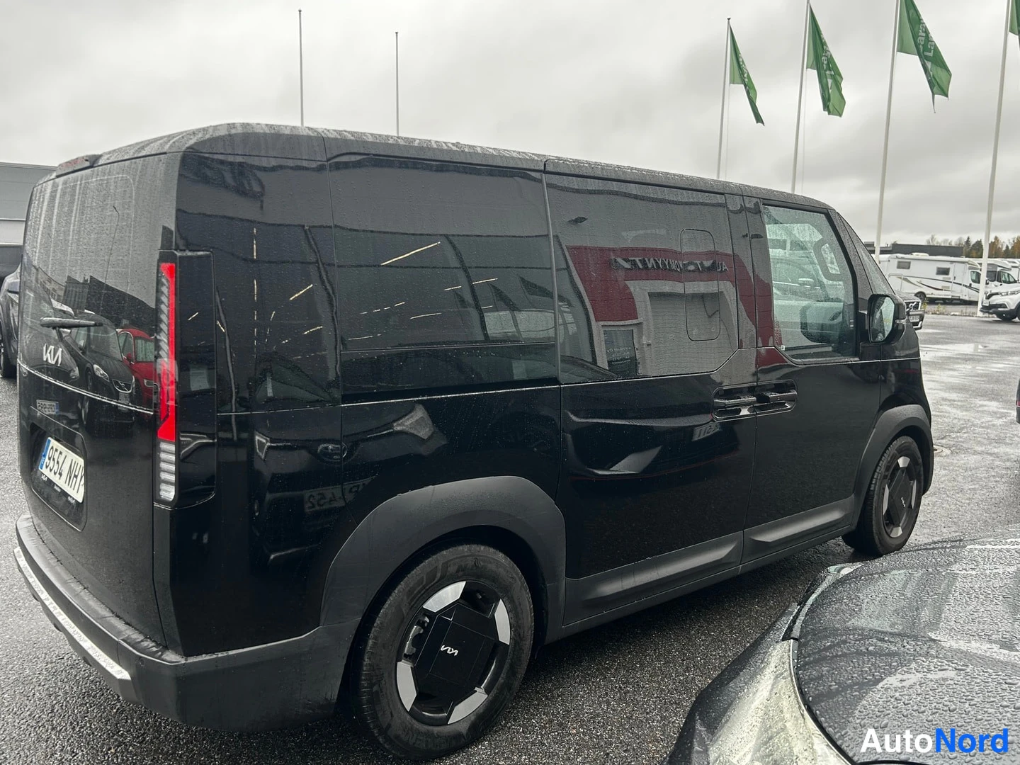 Black KIA PV5 2026, rear three-quarter, photo 4
