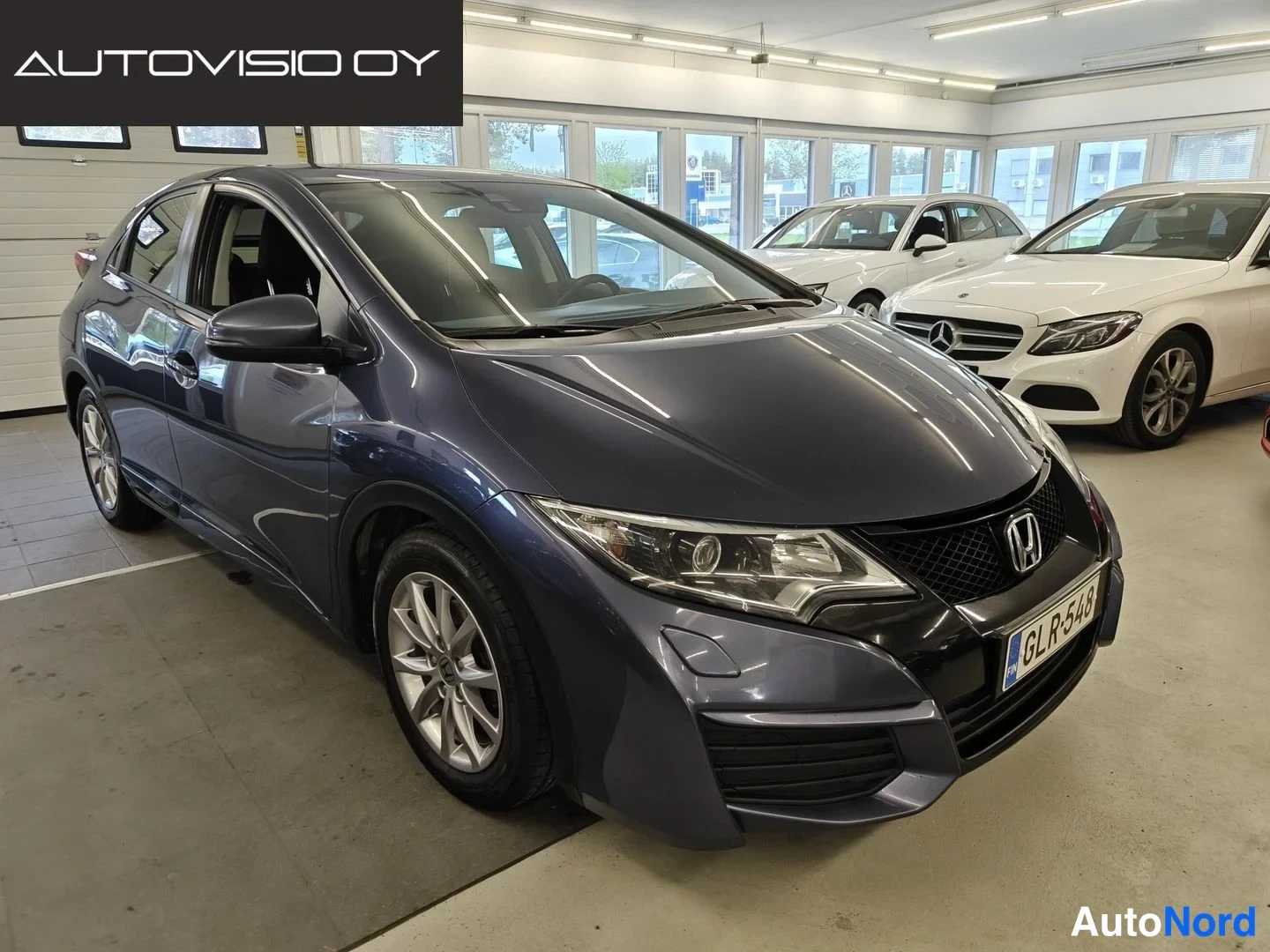 Blue Honda Civic 2016, front three-quarter, nose to the right, photo 2