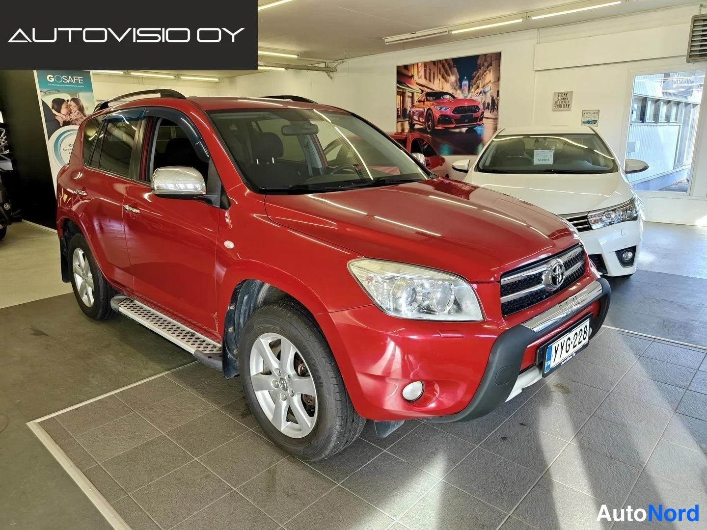 Red Toyota RAV4 2009, front three-quarter, nose to the right, photo 2
