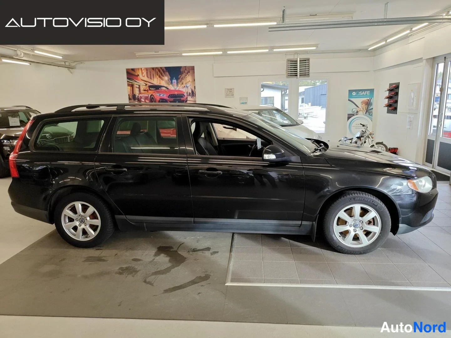 Black Volvo V70 2009, rear three-quarter, photo 3