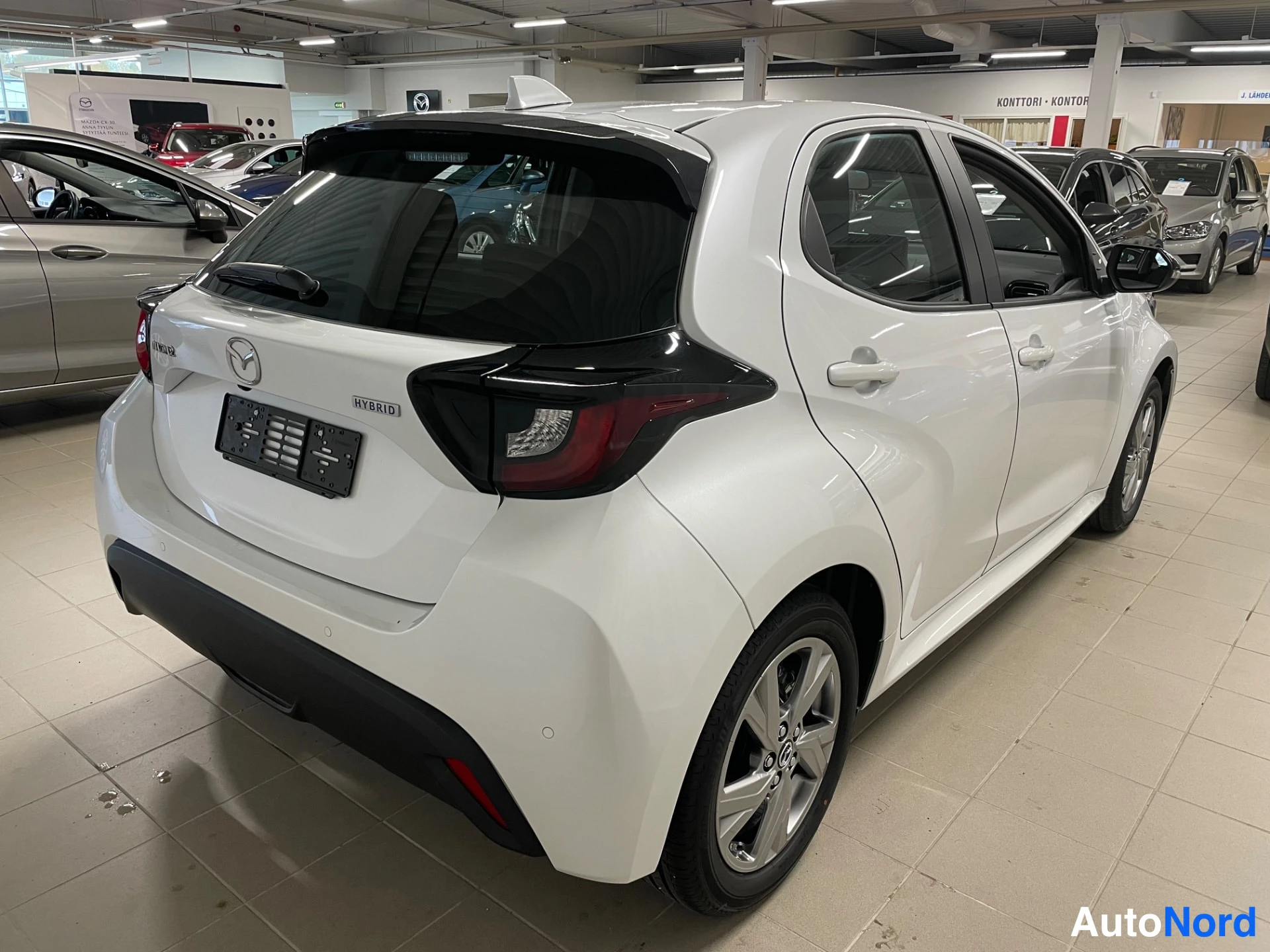 White Mazda Mazda2 Hybrid 2026, rear three-quarter, photo 7