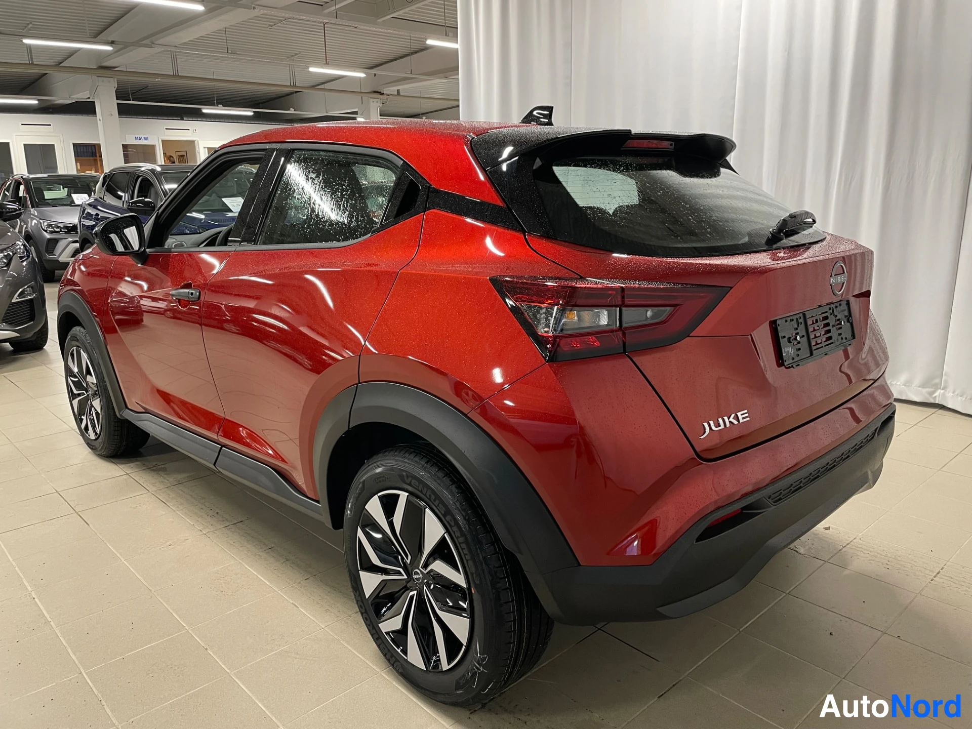 Red Nissan Juke 2026, rear three-quarter, photo 10