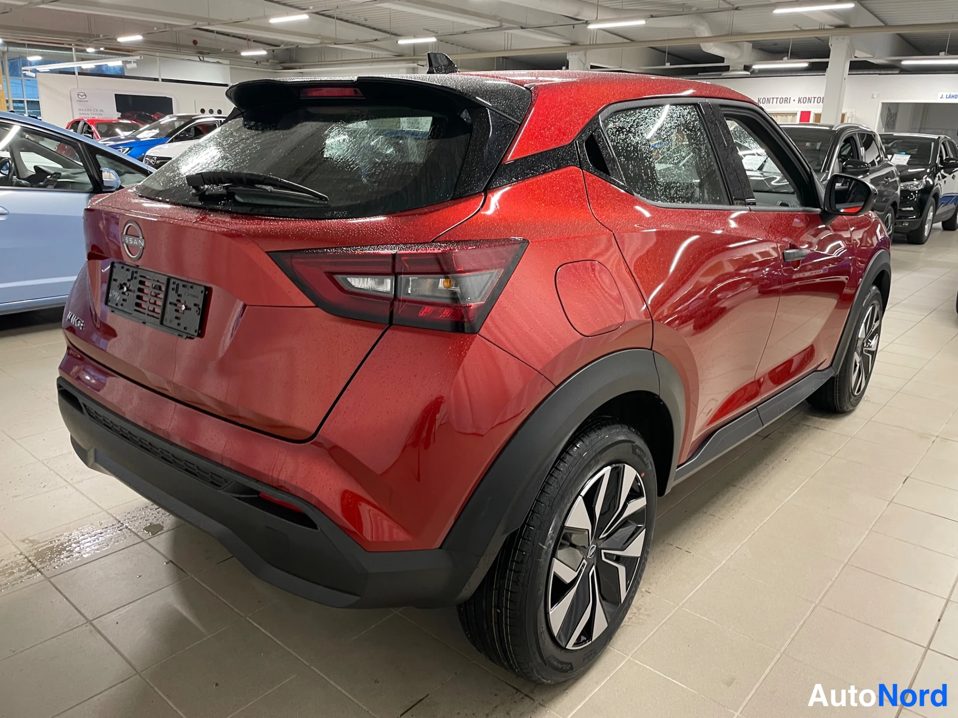 Red Nissan Juke 2026, rear three-quarter, photo 11