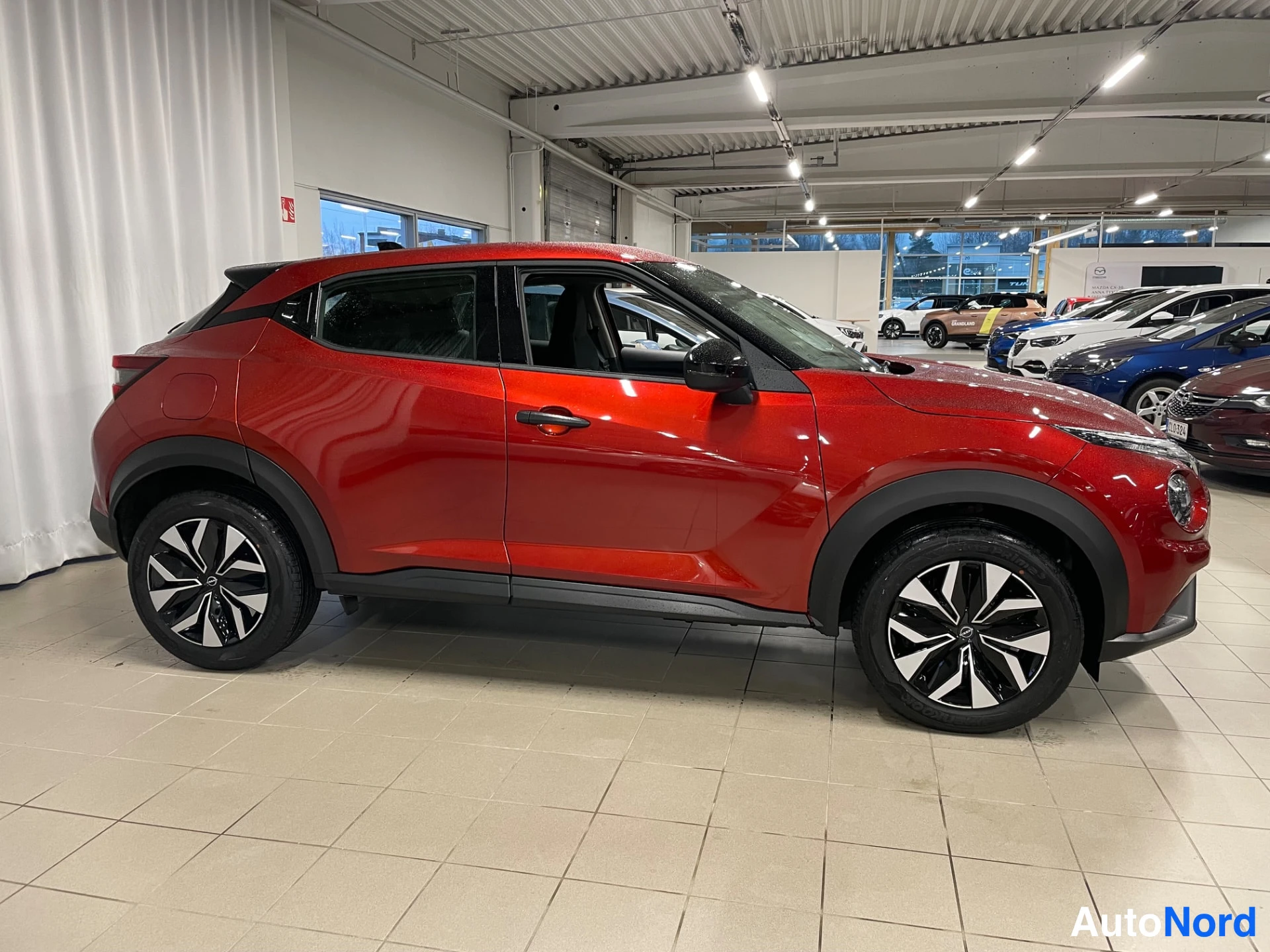 Red Nissan Juke 2026, side, photo 7