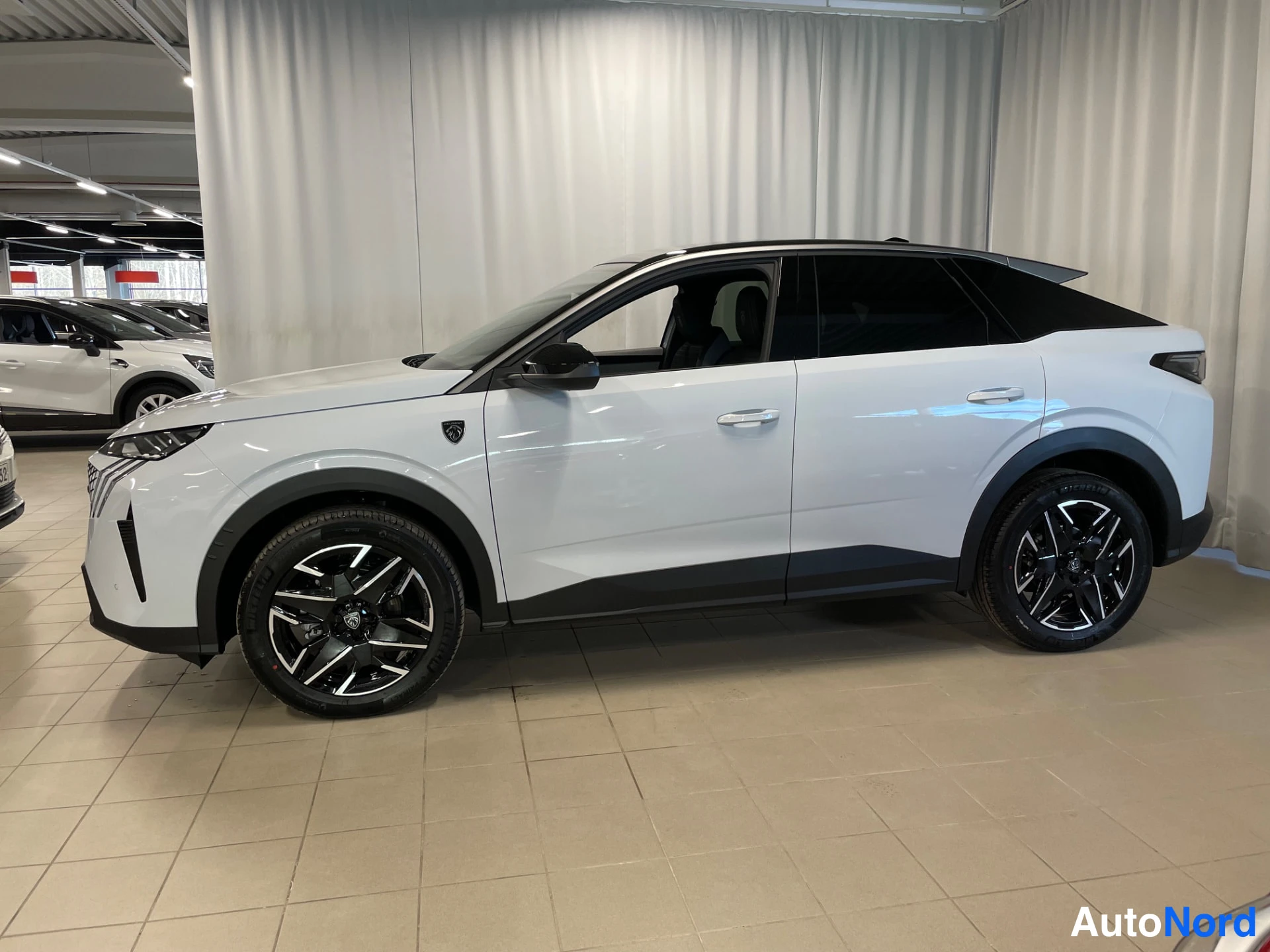 White Peugeot 3008 2026, front three-quarter, nose to the left, photo 2