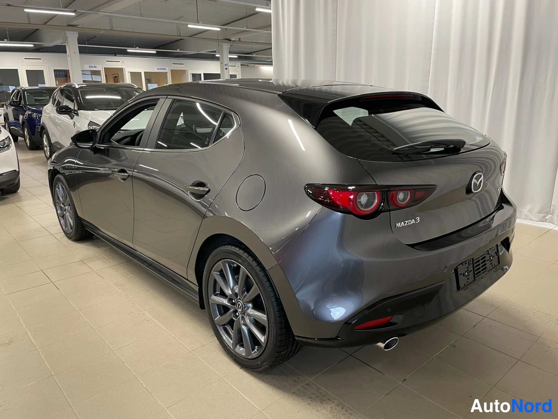 Grey Mazda Mazda3 2026, rear three-quarter, photo 6
