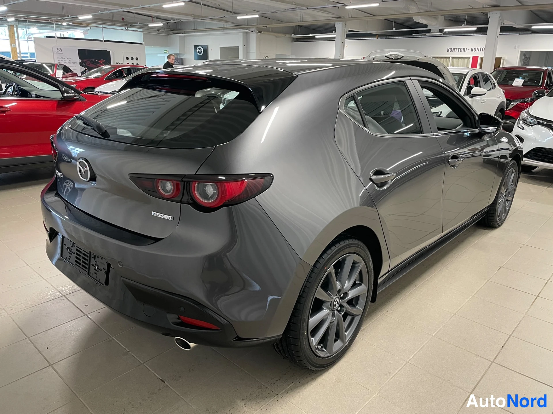 Grey Mazda Mazda3 2026, rear three-quarter, photo 7