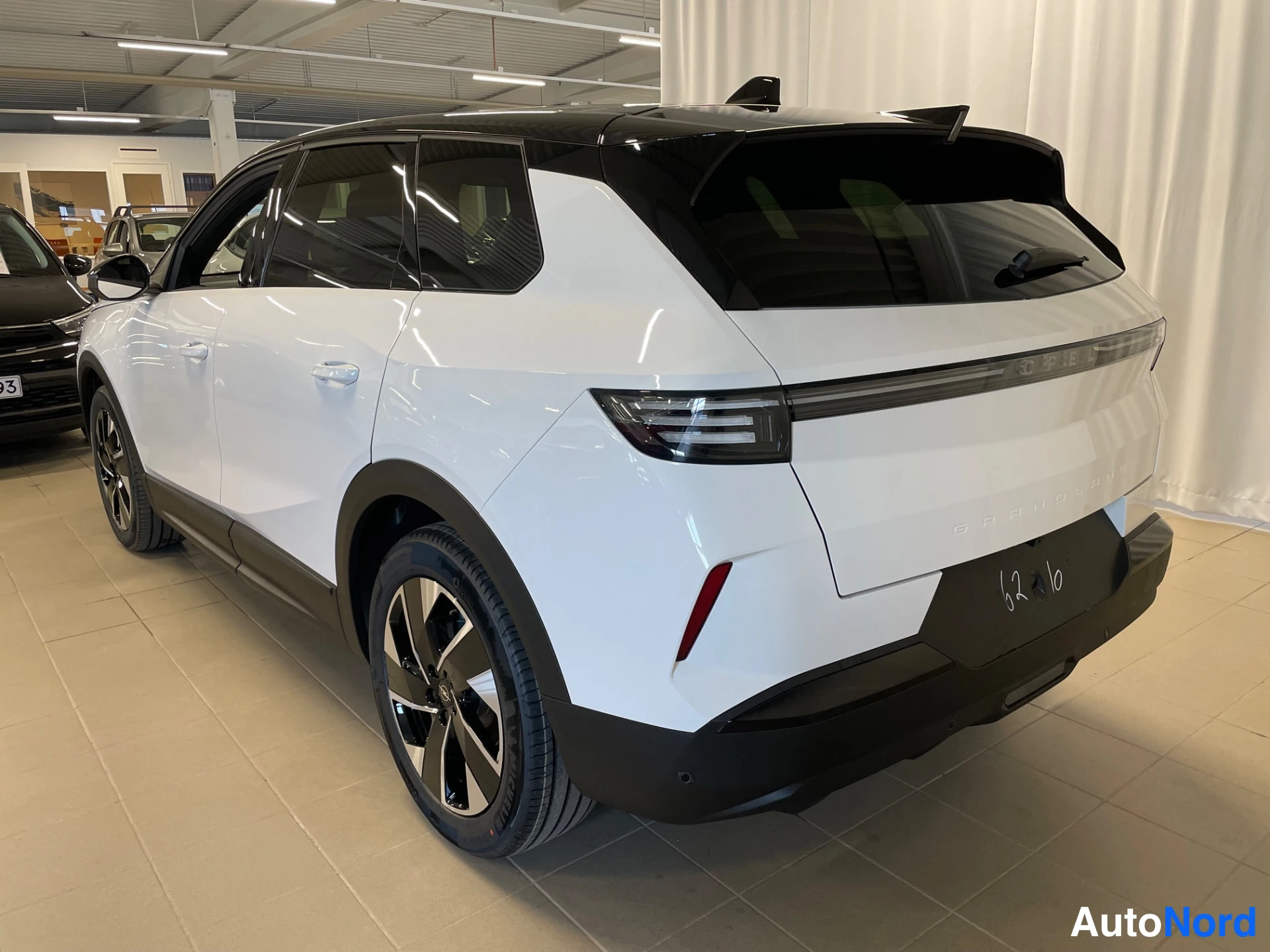 White Opel Grandland 2026, rear three-quarter, photo 6
