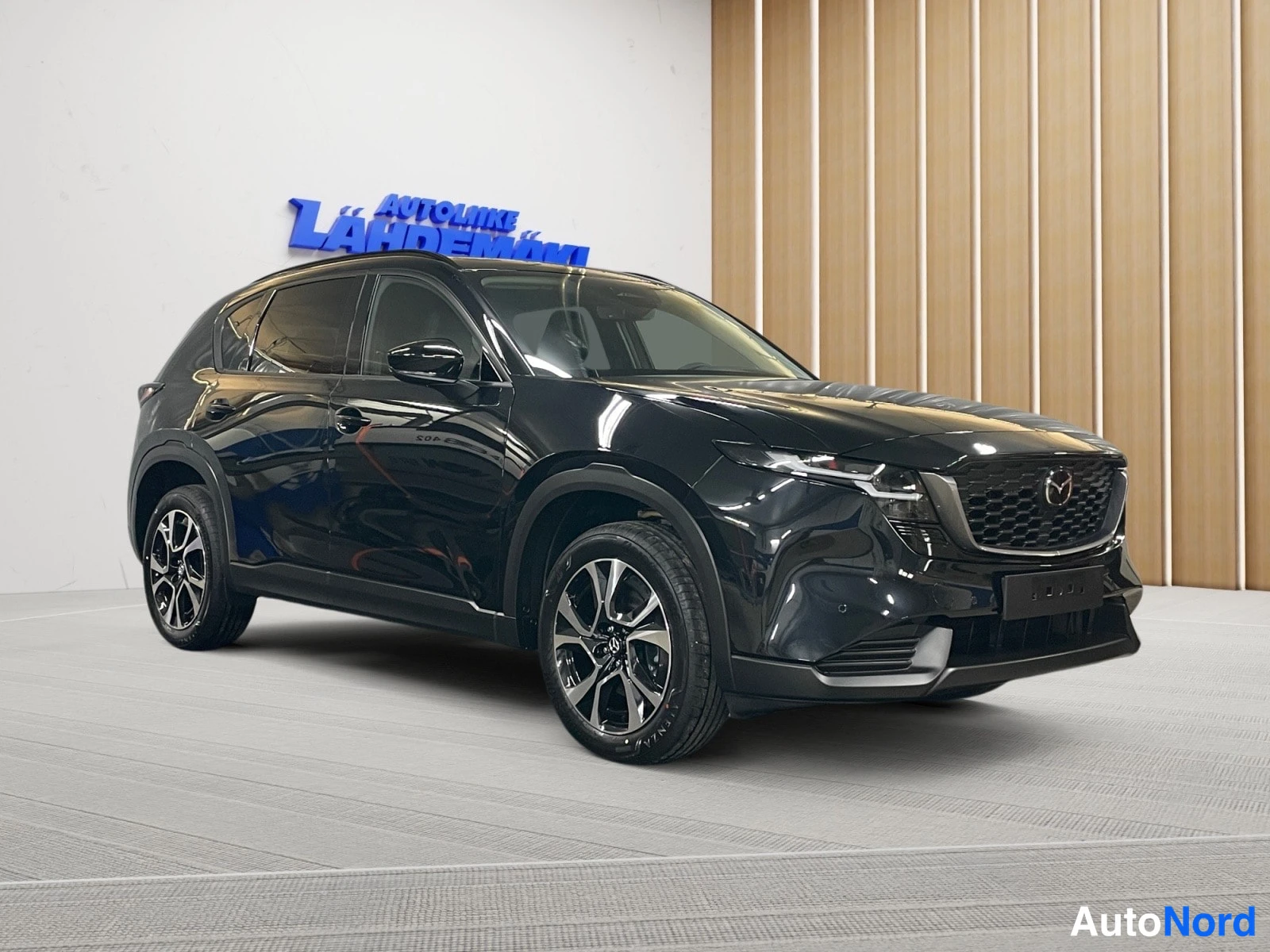 Black Mazda CX-5 2026, front three-quarter, nose to the right, photo 2