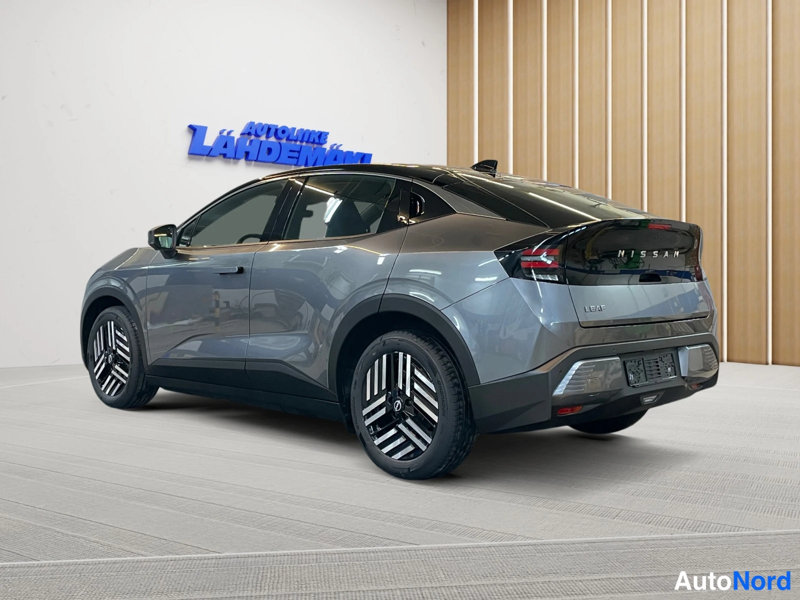 Grey Nissan Leaf 2026, rear three-quarter, photo 6