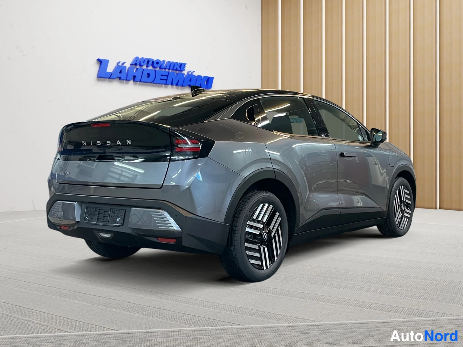 Grey Nissan Leaf 2026, rear three-quarter, photo 7