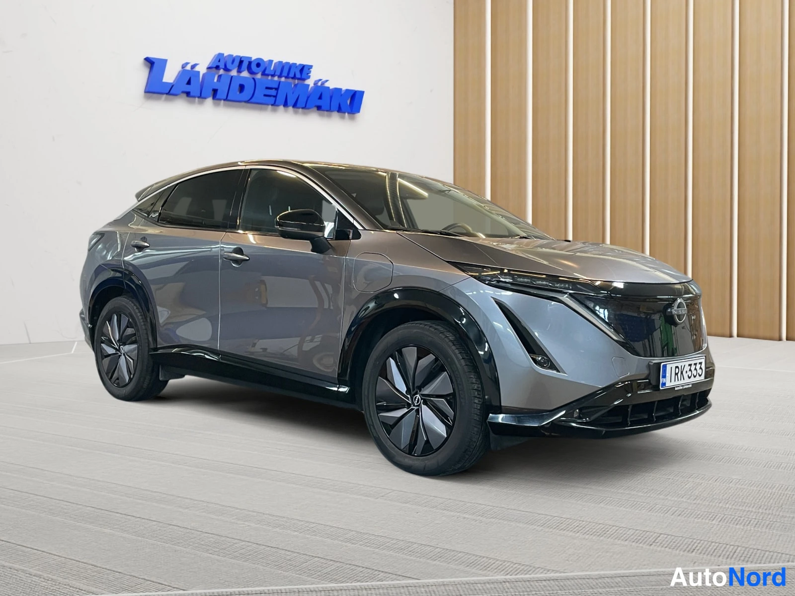 Grey Nissan Ariya 2023, front three-quarter, nose to the right, photo 2