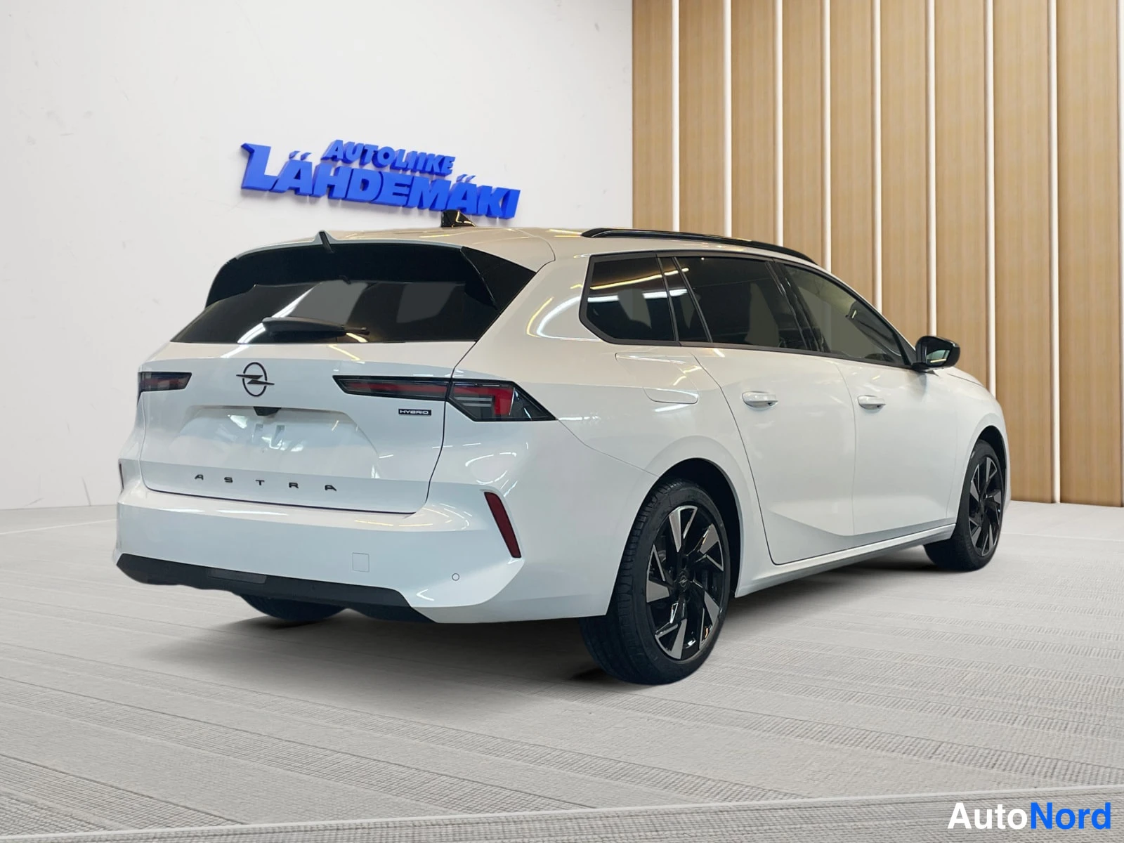 White Opel Astra 2026, rear three-quarter, photo 7
