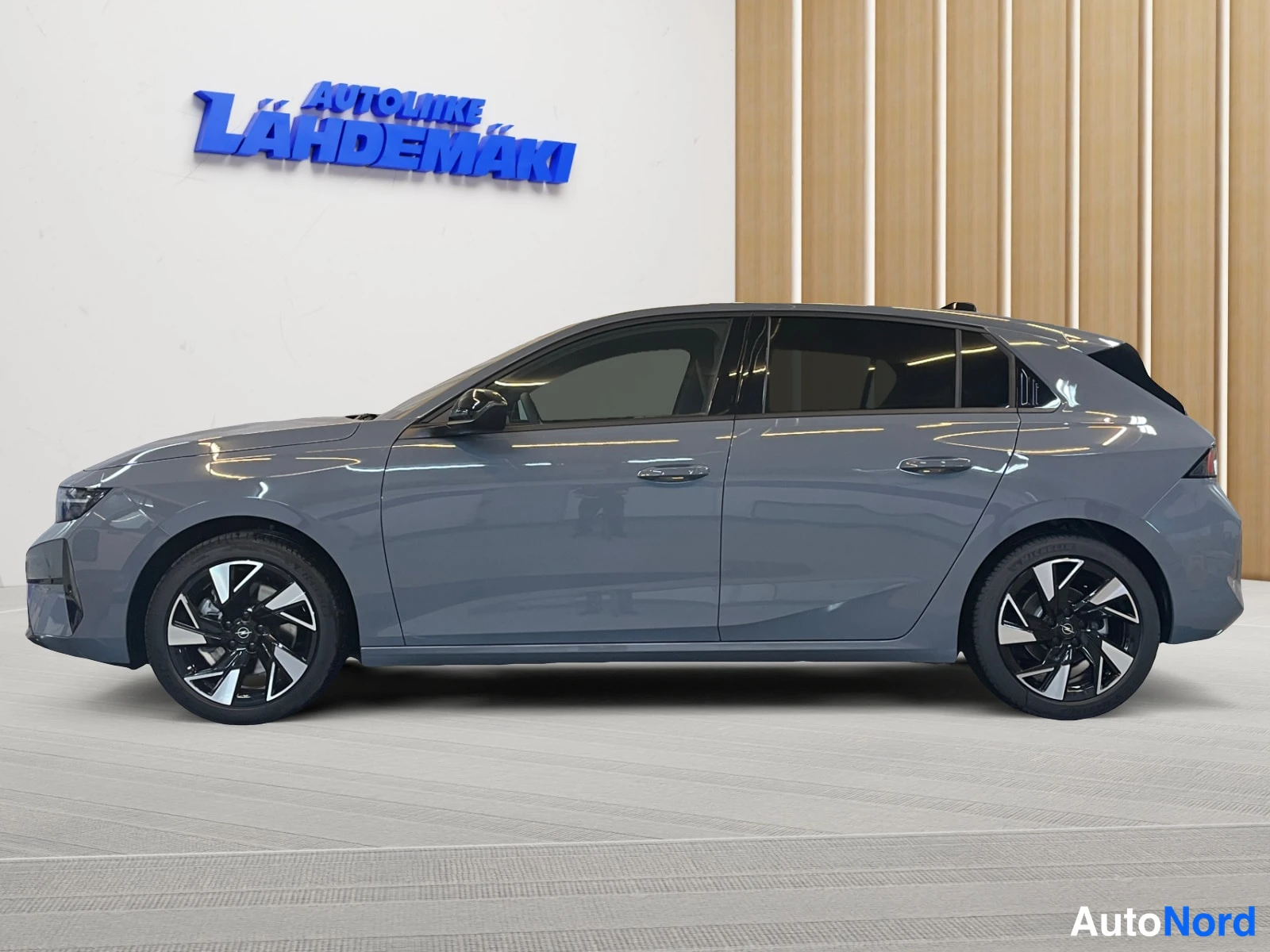 Grey Opel Astra 2026, side, photo 5