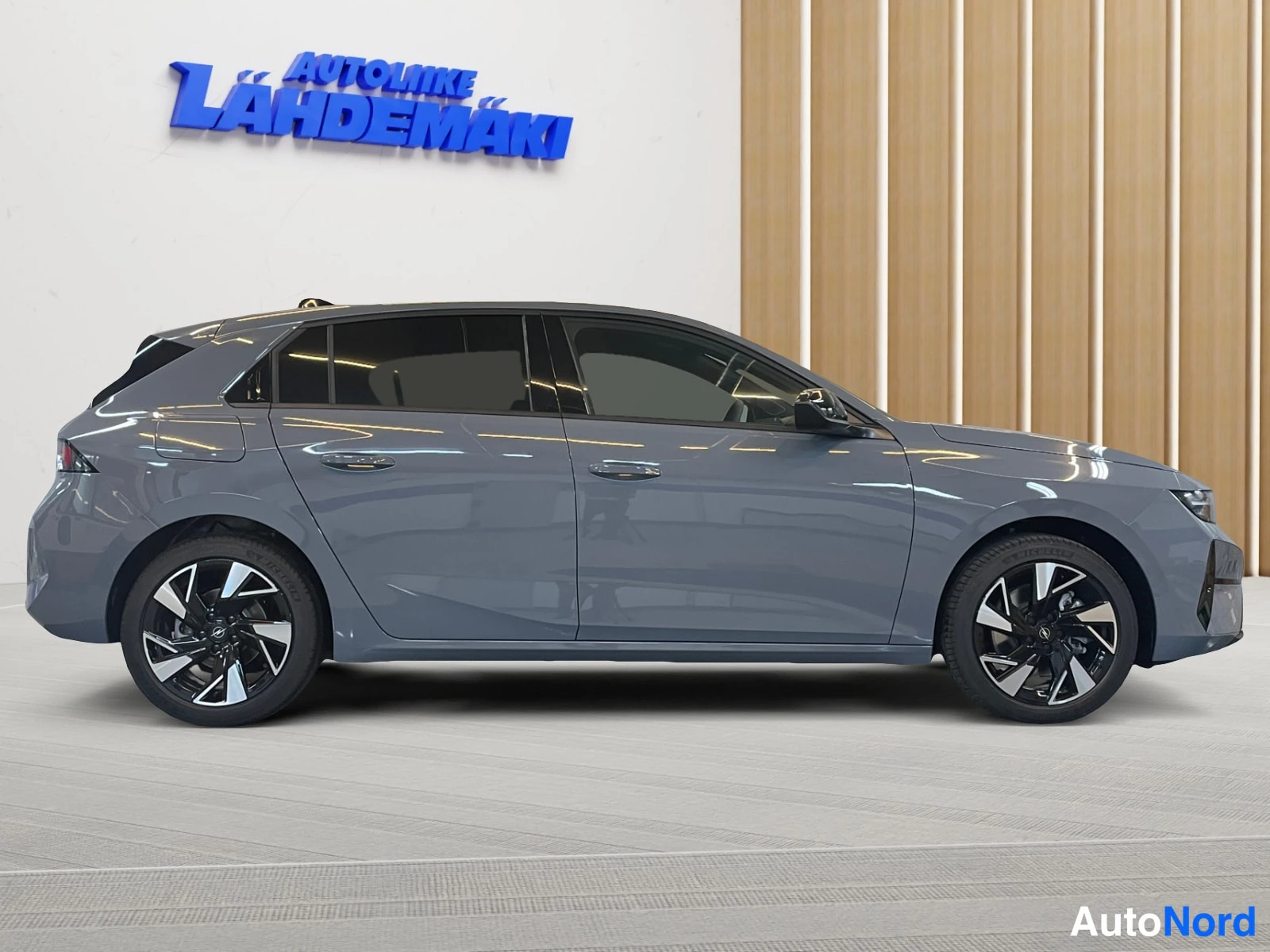 Grey Opel Astra 2026, side, photo 6