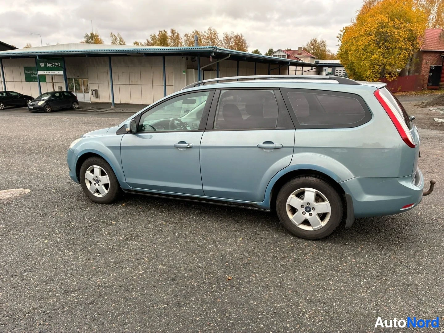 Blue Ford Focus 2009, rear three-quarter, photo 6