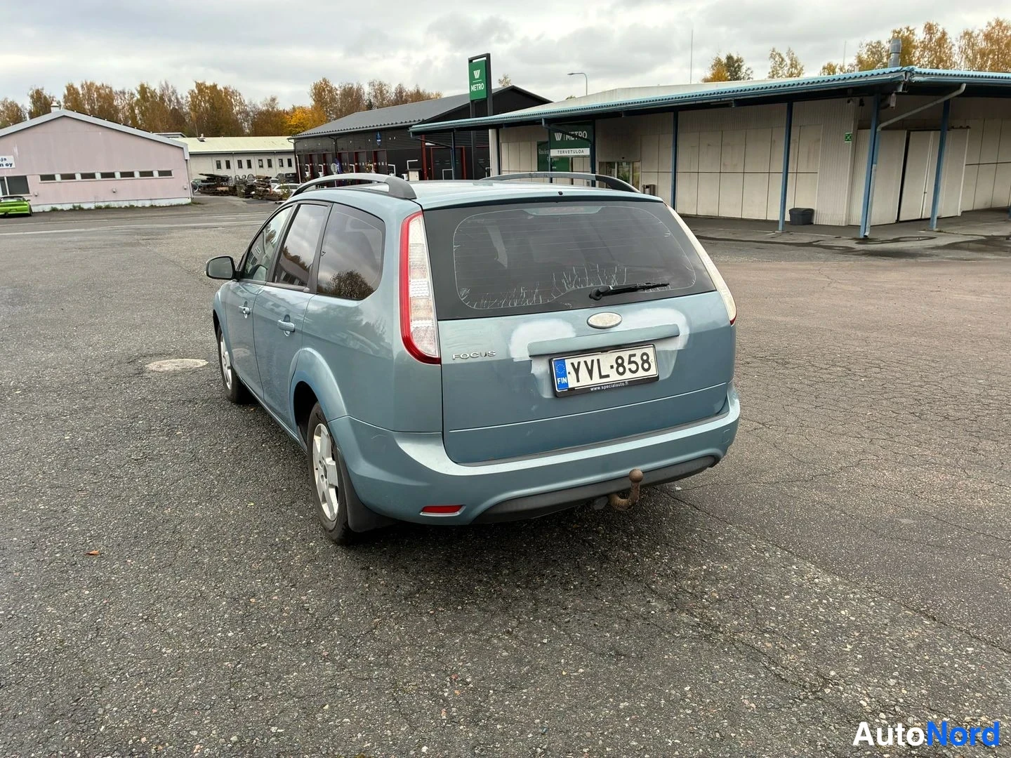 Blue Ford Focus 2009, rear three-quarter, photo 7