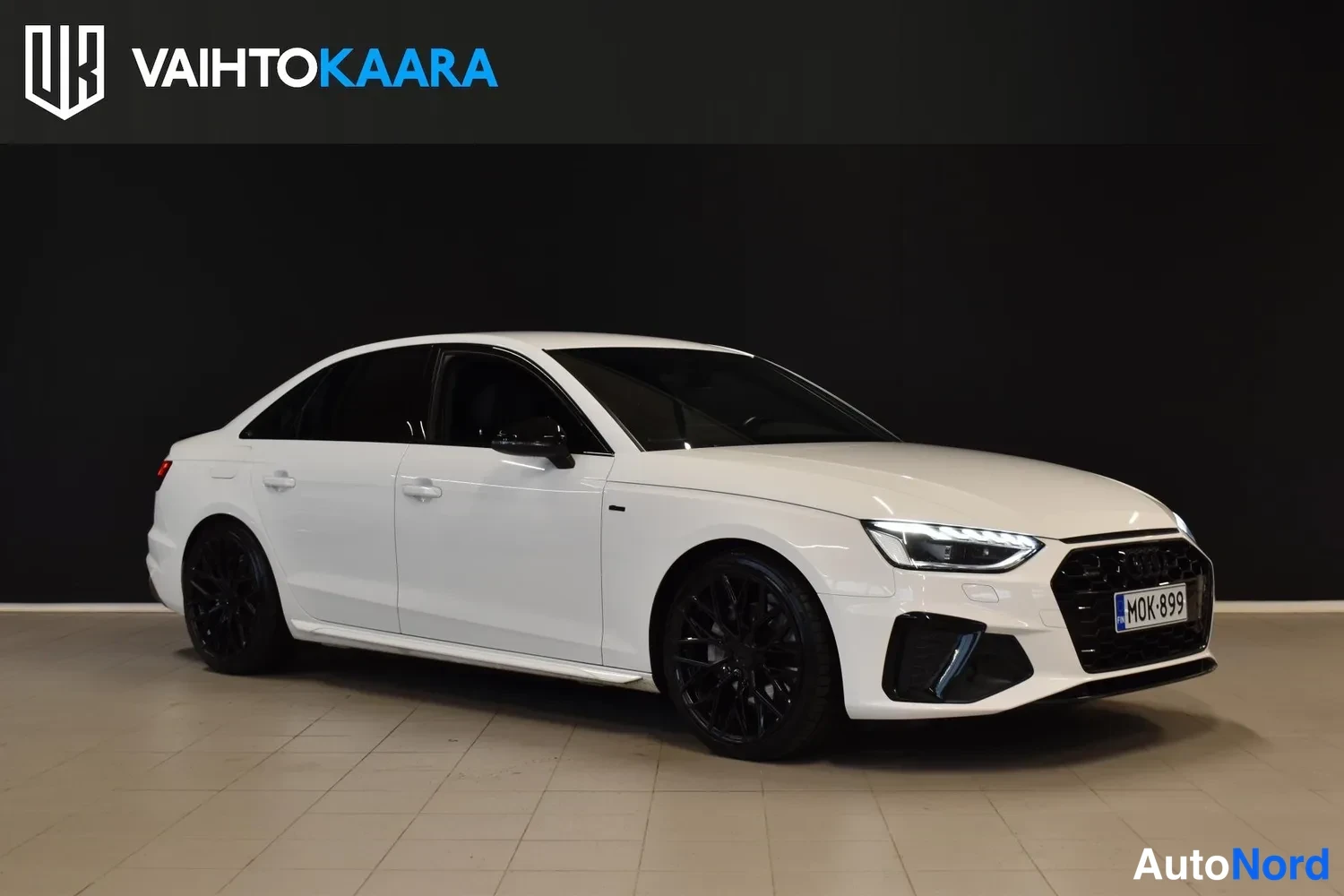 White Audi A4 2022, front three-quarter, nose to the right, photo 3