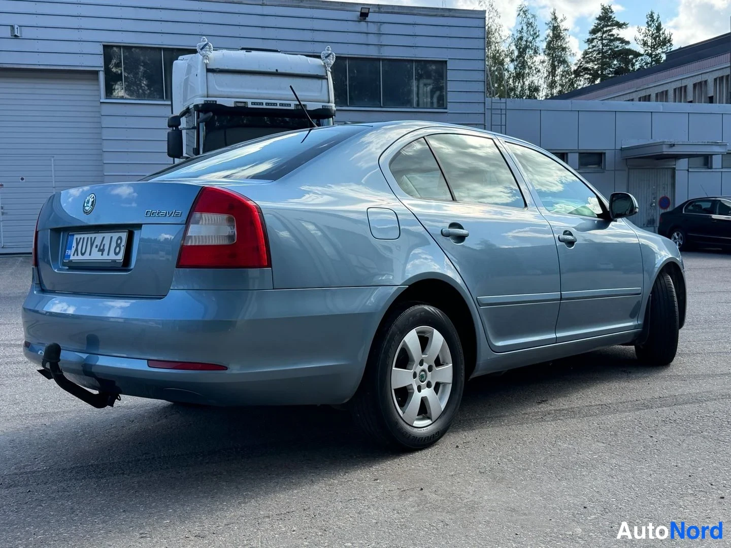 Turkoosi Skoda Octavia 2011, takaviisto, kuva 4