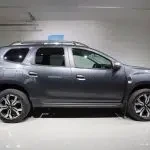 Blue Dacia Duster 2023, side, photo 6
