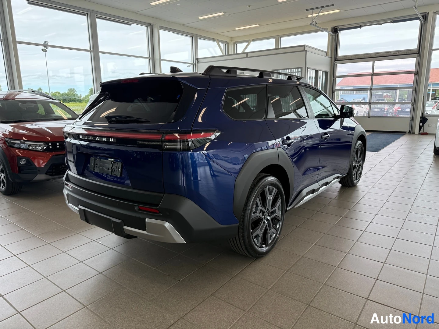 Blue Subaru Outback 2026, rear three-quarter, photo 6