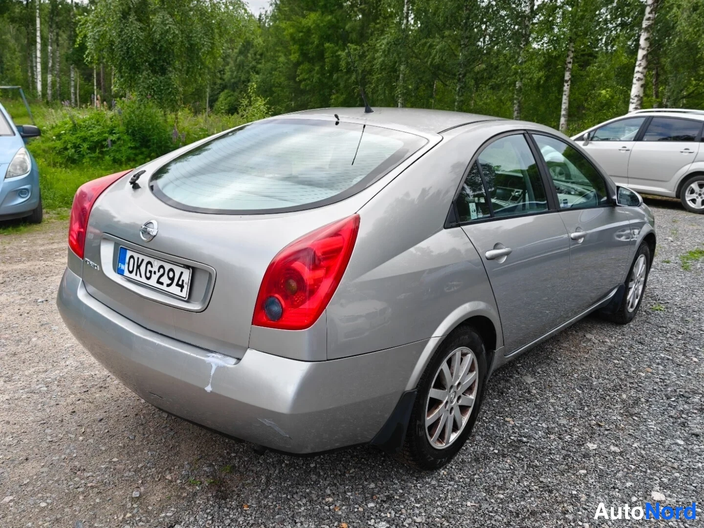 Grey Nissan Primera 2003, rear three-quarter, photo 6