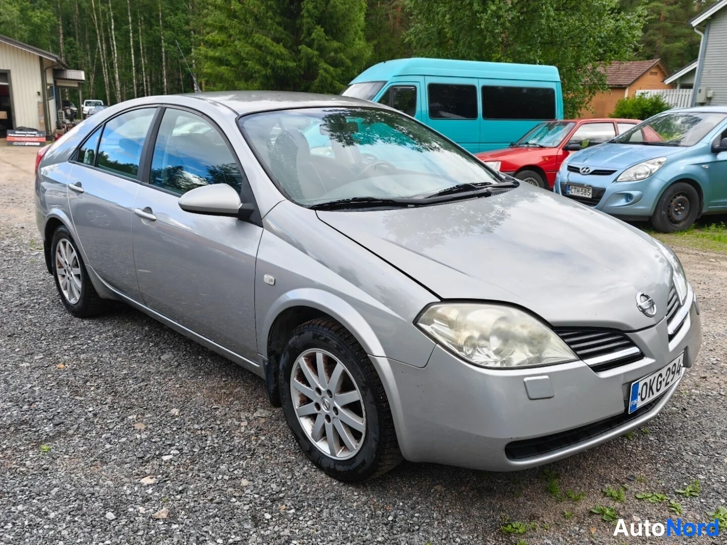 Grey Nissan Primera 2003, front three-quarter, nose to the right, photo 3