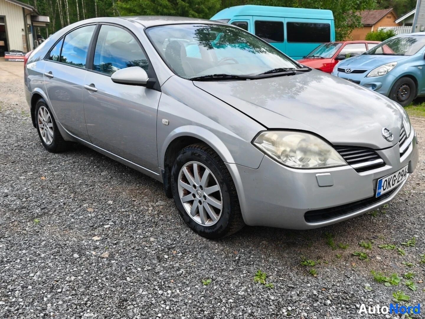 Grey Nissan Primera 2003, front three-quarter, nose to the right, photo 4