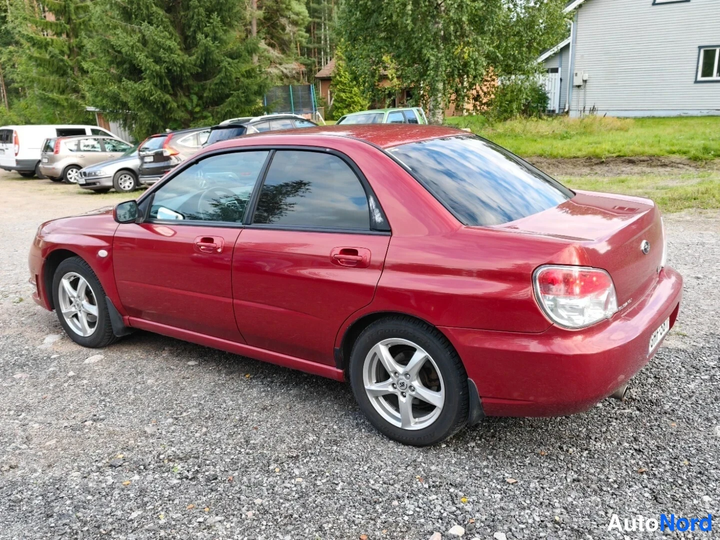 Red Subaru Impreza 2006, rear three-quarter, photo 4