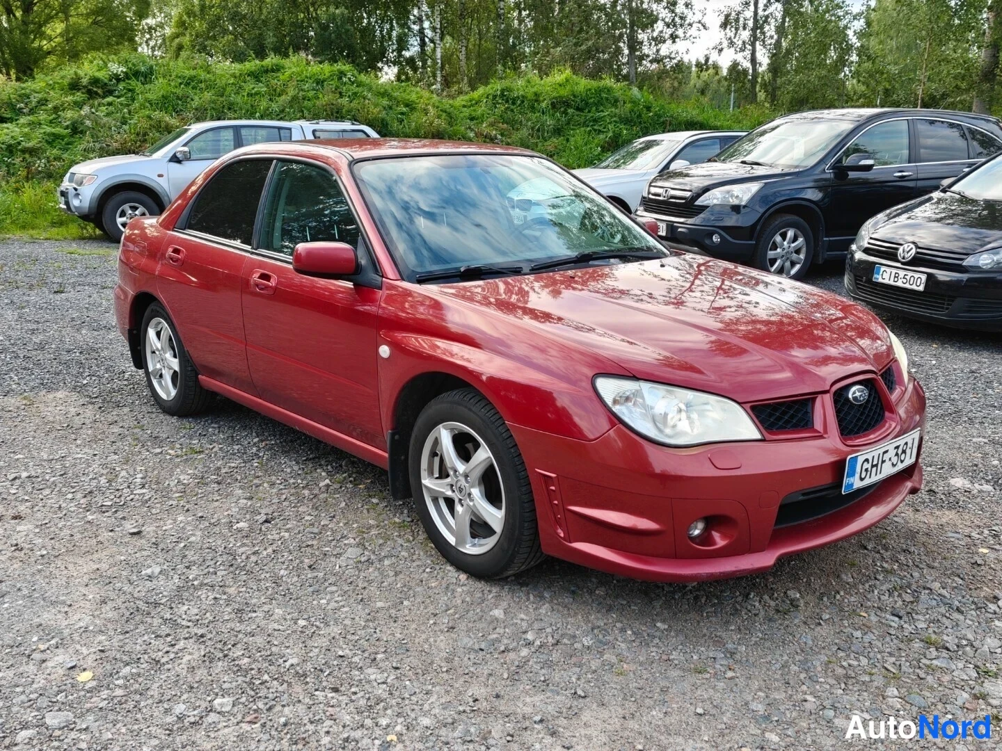 Red Subaru Impreza 2006, front three-quarter, nose to the right, photo 3