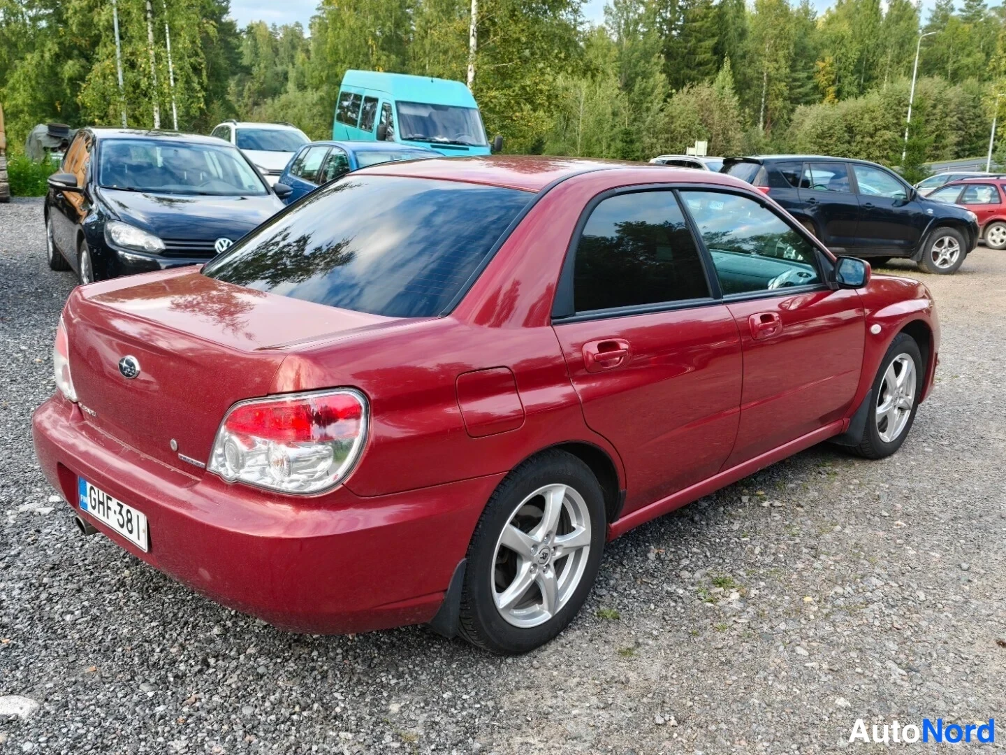 Red Subaru Impreza 2006, rear three-quarter, photo 5