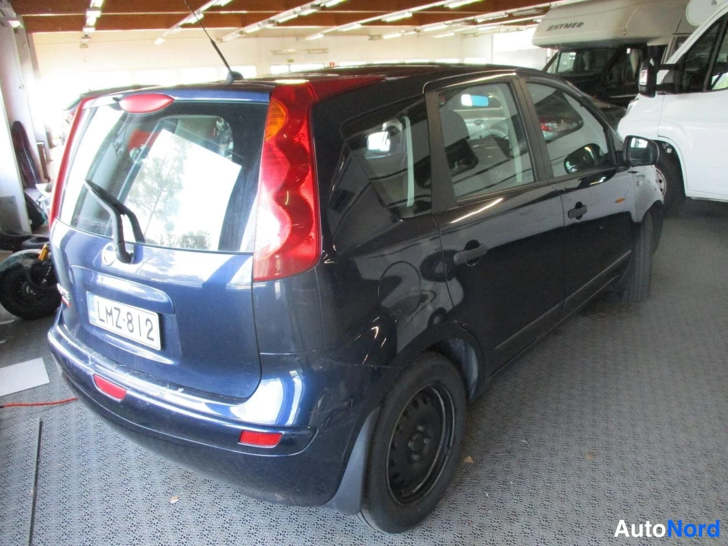 Blue Nissan Note 2008, rear three-quarter, photo 5