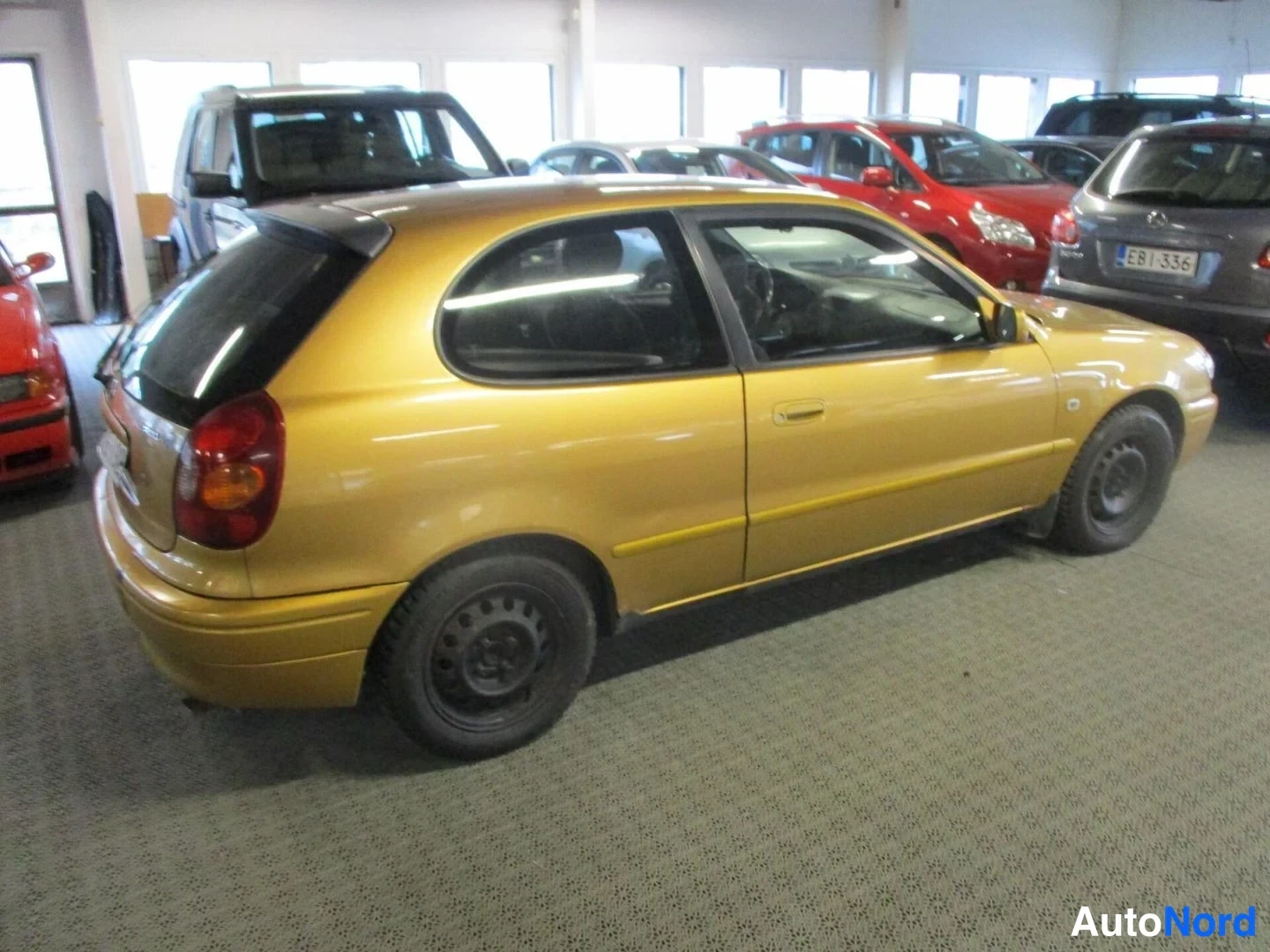 Yellow Toyota Corolla 2000, rear three-quarter, photo 5