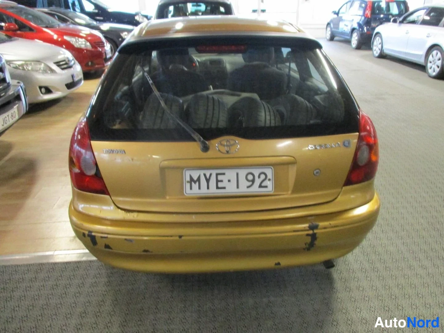 Yellow Toyota Corolla 2000, rear, photo 7