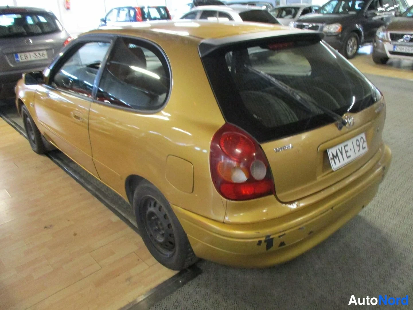 Yellow Toyota Corolla 2000, rear three-quarter, photo 6