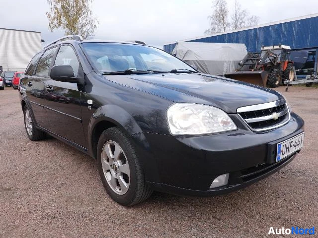 Musta Chevrolet Nubira 2010, etuviisto, keula oikealle, kuva 7