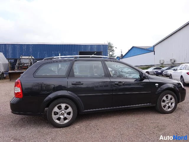 Musta Chevrolet Nubira 2010, etuviisto, keula oikealle, kuva 9
