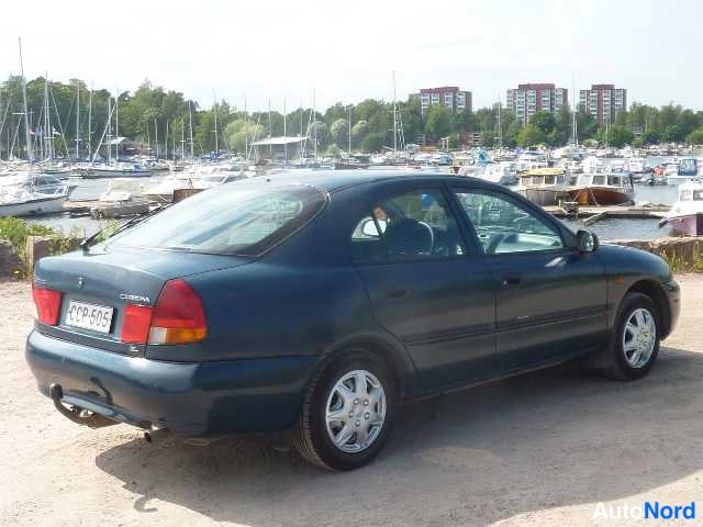 Sininen Mitsubishi Carisma 1998, takaviisto, kuva 15