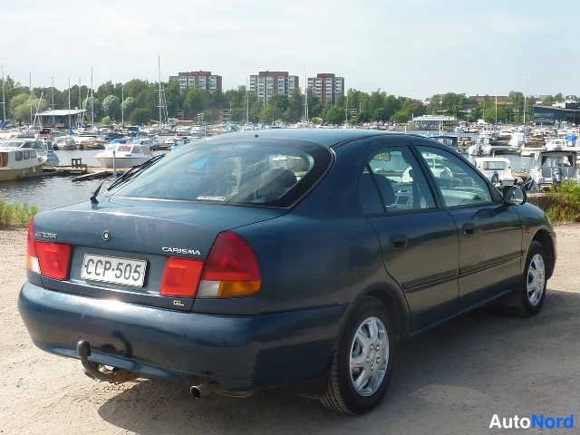 Sininen Mitsubishi Carisma 1998, takaviisto, kuva 16