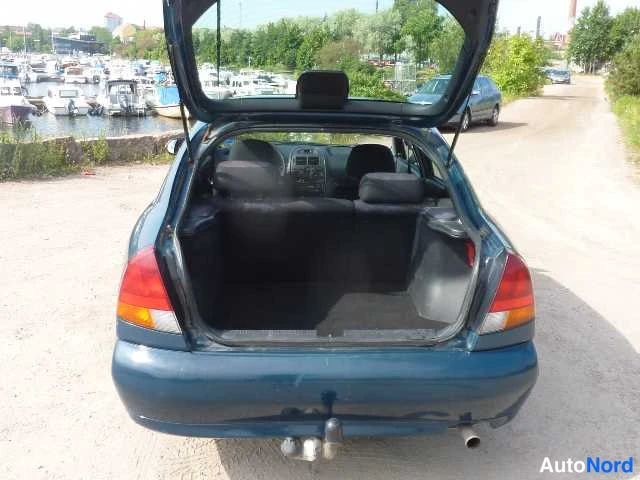 Sininen Mitsubishi Carisma 1998, takaa, kuva 20