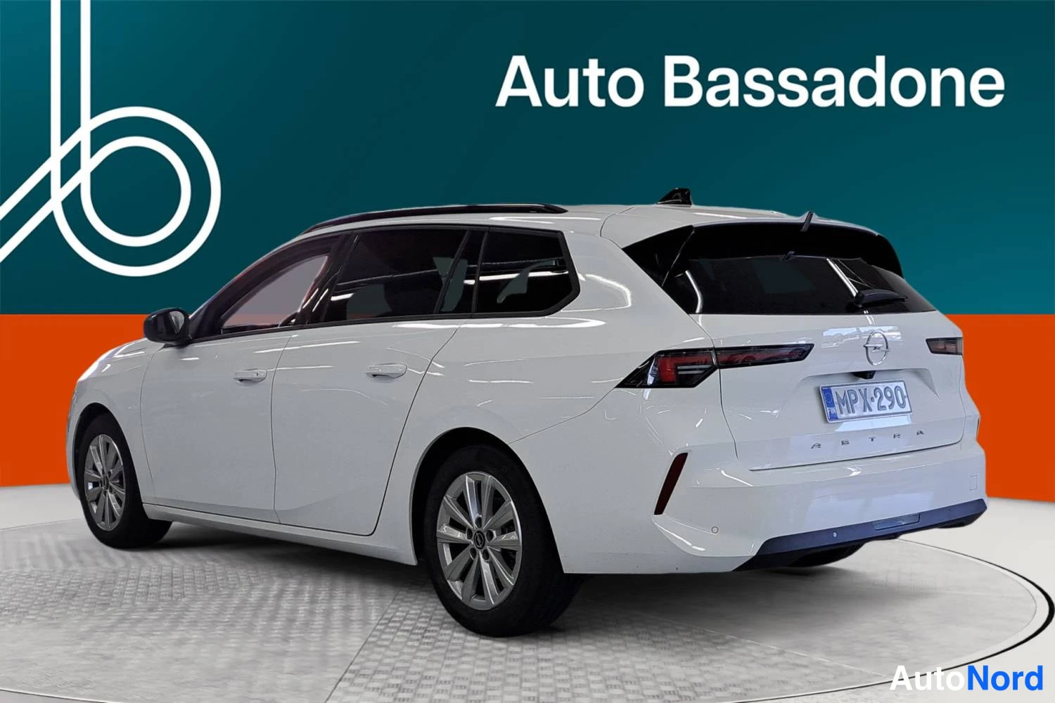 White Opel Astra Sports Tourer 2024, rear three-quarter, photo 6